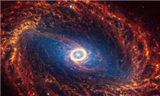 جیمز وب بازوهای مارپیچی کهکشان NGC 2090 را در نور فروسرخ ردیابی می‌کند!⁠